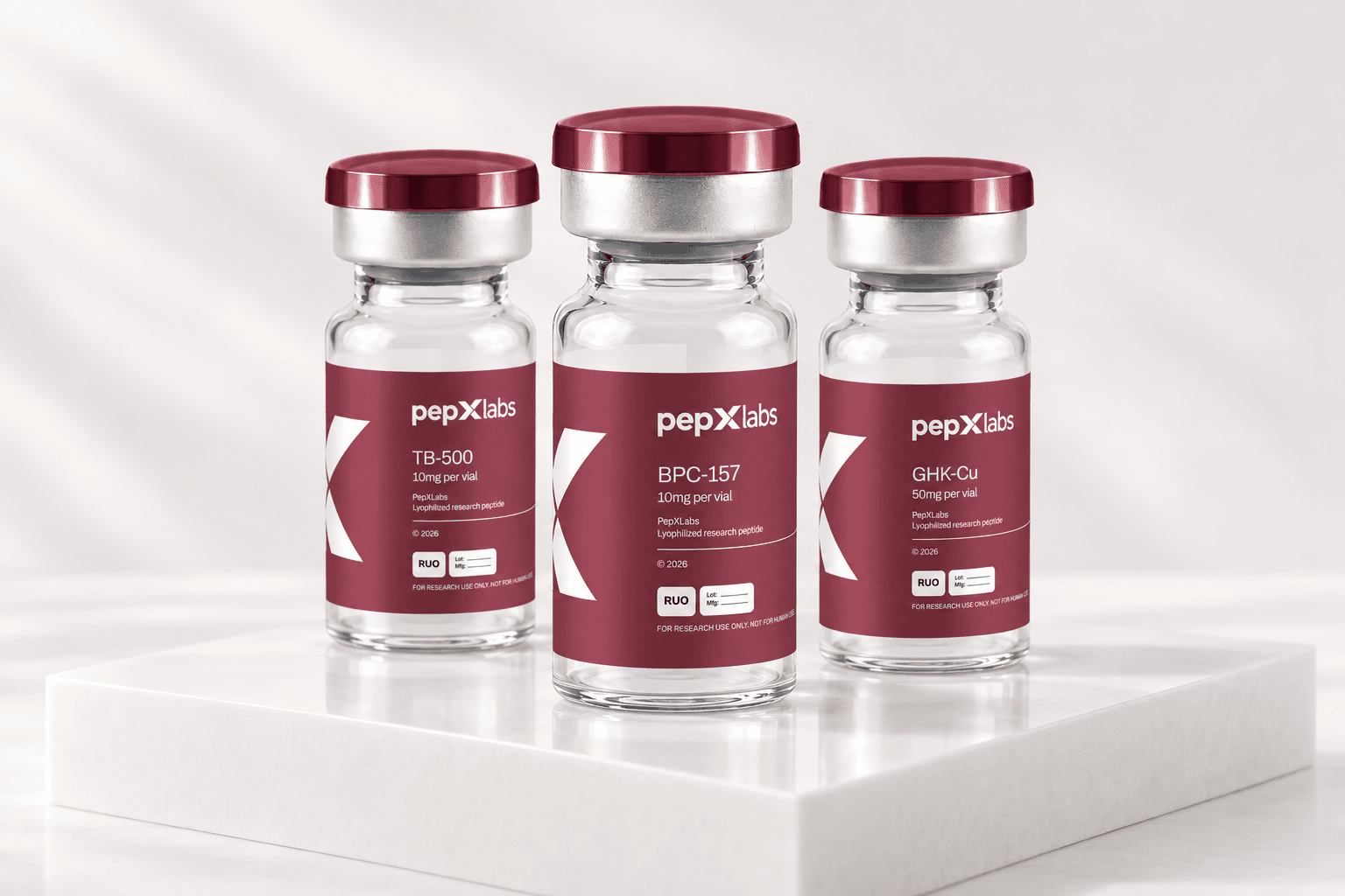 PepXLabs TB-500, BPC-157 and GHK-Cu research vials on a white display